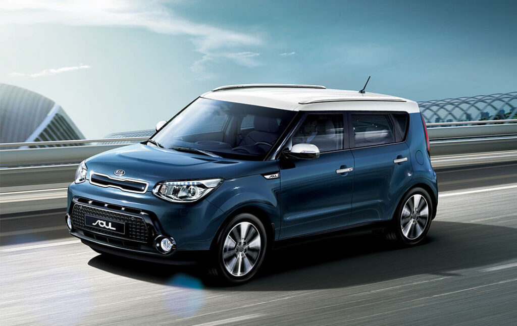 Blue car going down highway